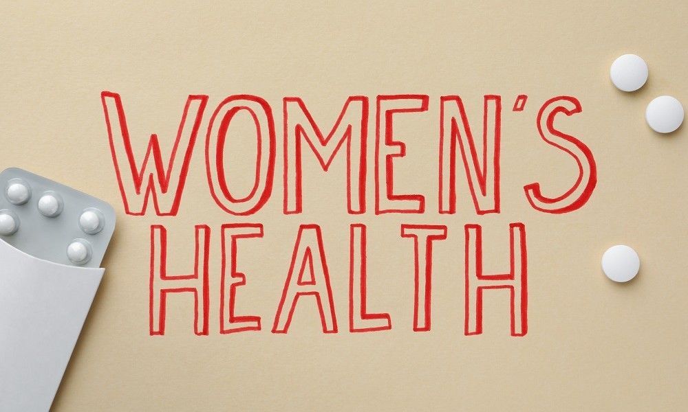 Brauner Hintergrund mit dem Schriftzug Women's Health 